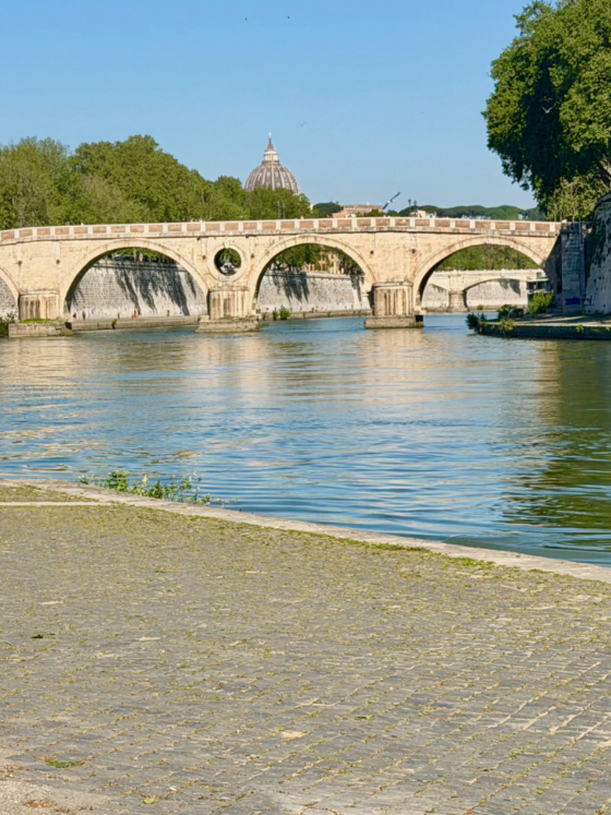 Runner by a river and bridge